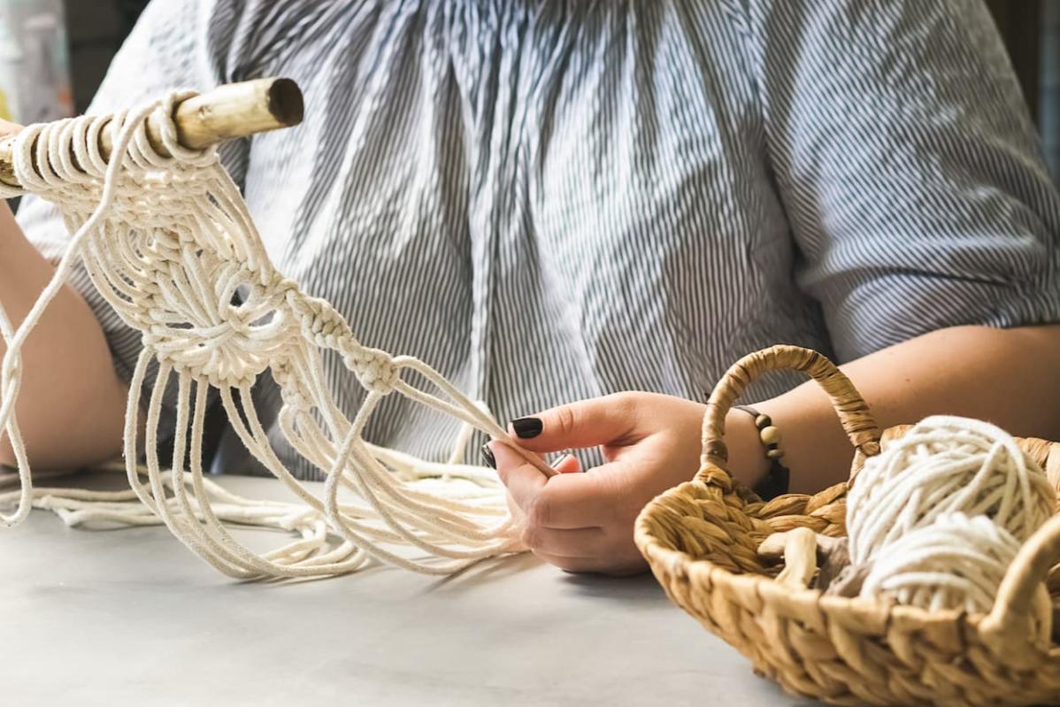 Top 12 Best Team Building Companies In Malaysia 2025 11 Participant crafting an item by knitting for the teambuilding event