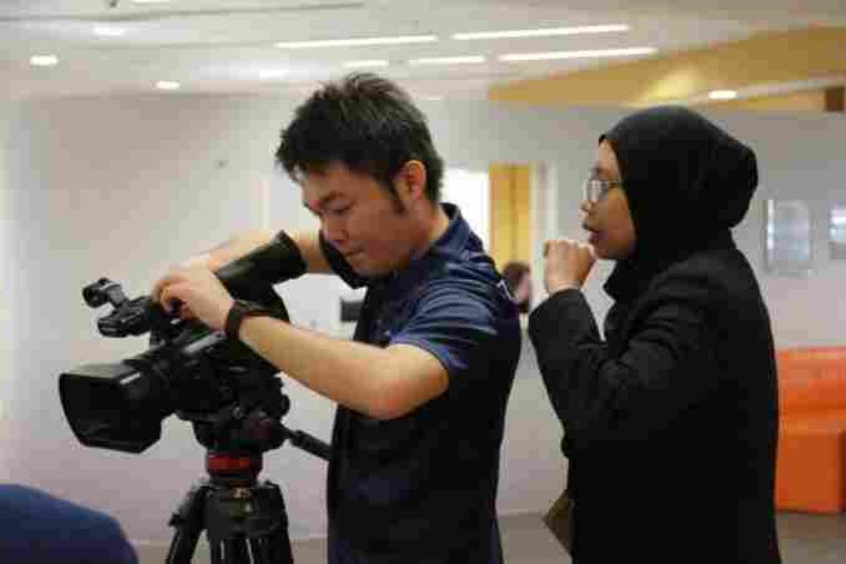 Top 12 Best Team Building Companies In Malaysia 2025 12 Participant working the camera as training offers her instructions