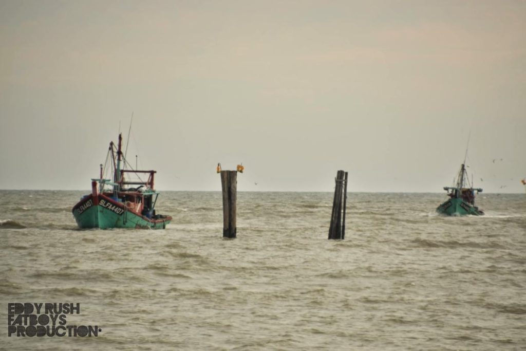 Top 10 Best Things To Do in Sekinchan Beach 2025 21 Feel-the-Cool-Ocean-Breeze-While-Watching-Fishing-Boats-Sail-by-