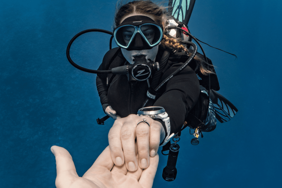Top 20 Best Proposal Ideas in Malaysia 2025 12 Diver showing engagement ring underwater